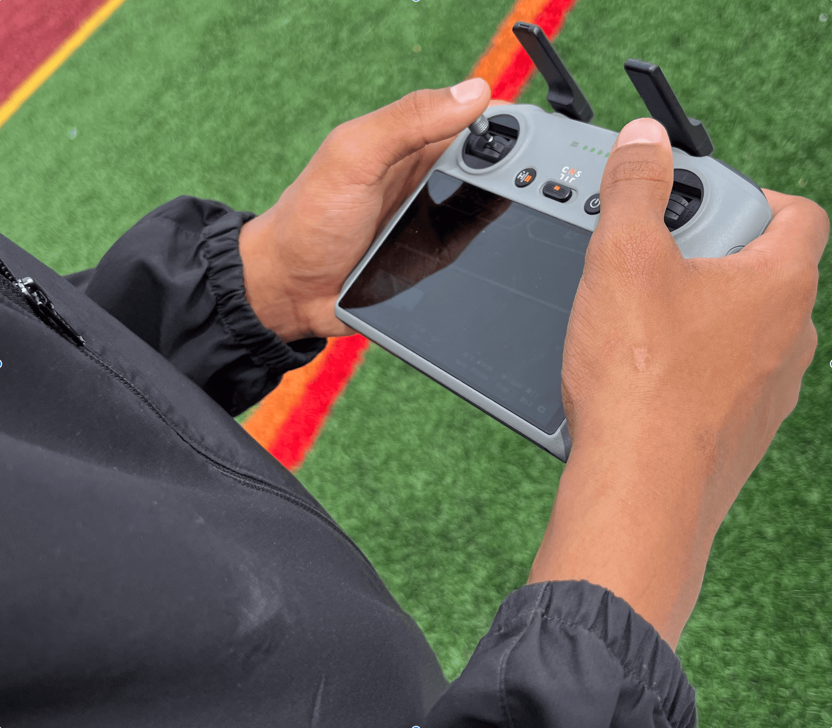 Student learning to fly a drone